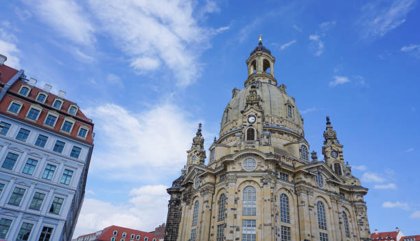 Tourists in front of the baroque lutheran Frauenkirche (our lady) church and the historical buildigns in Dresden, Saxony, Germany