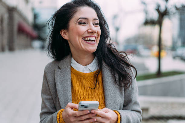 istock Woman using smartphone outdoors. 2152226524