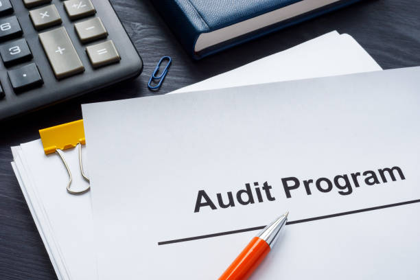 istock The papers audit program lie next to the calculator. 2152229903