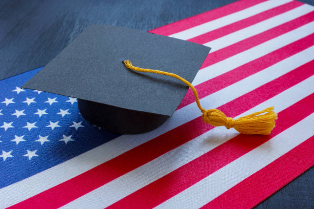 istock Student hat on the US flag as a symbol of education. 2152229911