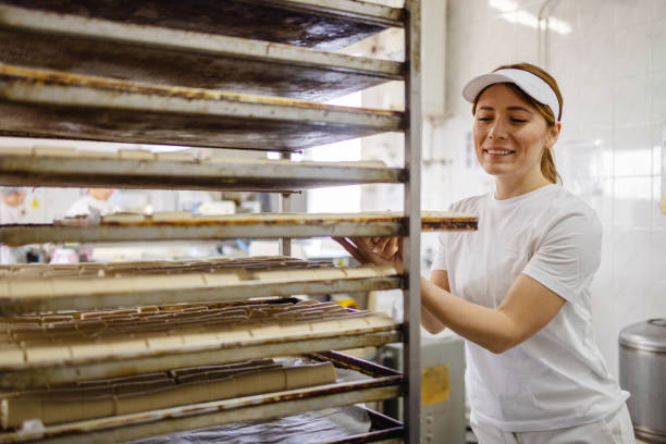 istock Female Baker Working in Baker Shop 2152233002