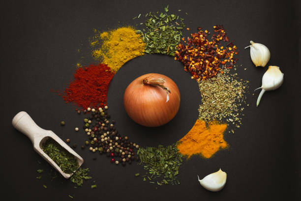 istock Circle frame composition of spices and herbs isolated on dark background with copy space. Frame of Indian spices and herbs. Ingredients of asian cuisine spices 2152233806