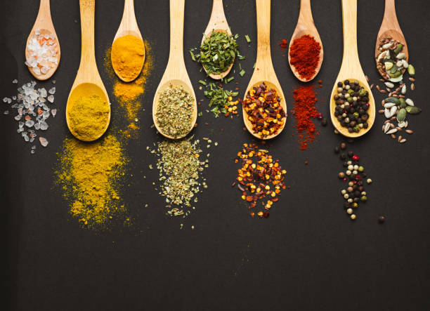istock Various Asian spices in spoons on black background. Top view with free space 2152233843