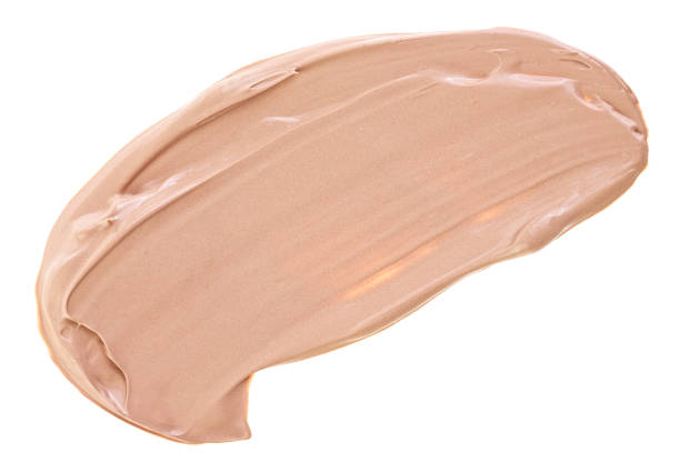 istock Makeup foundation smear smudge swatch isolated on a white background, top view. Cosmetic liquid foundation. Beige color concealer, BB cream sample. 2152236106