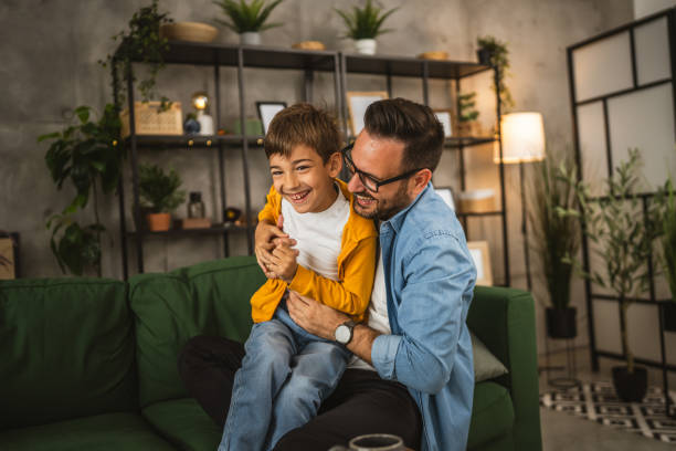 istock Dad hug son and share love with him spend time together at home 2152239258