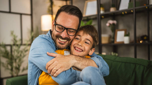 istock Dad hug son and share love with him spend time together at home 2152239315