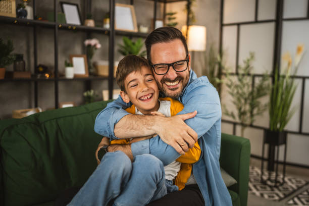 istock Dad hug son and share love with him spend time together at home 2152239318