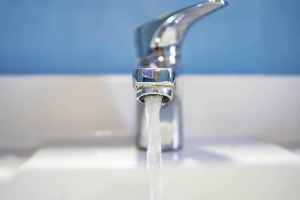 istock Front view of water flow from the sink. 2152240976