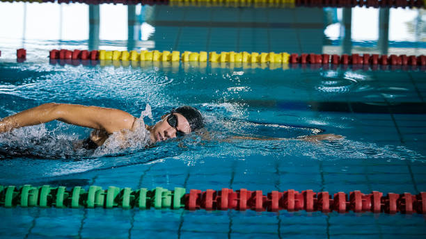istock Elite female swimmer during a front crawl swimming training 2152241822