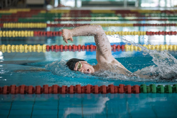 istock Professional male swimmer swimming the front crawl style 2152242417