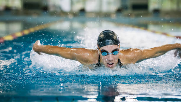 Front view of a female swimmer performing butterfly technique