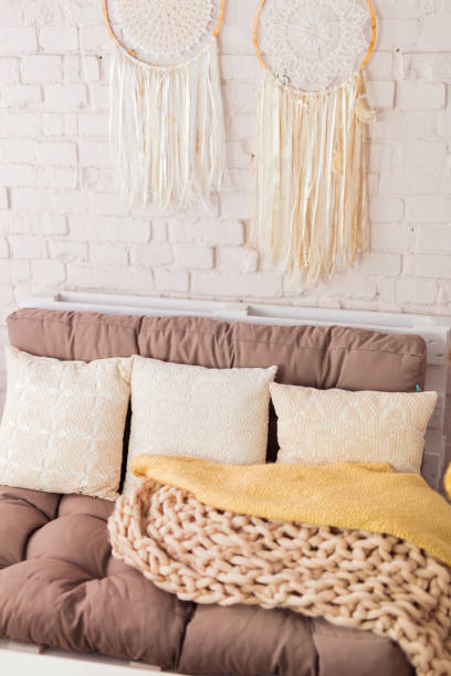 istock Closeup of pillows and blankets on a couch 2152243559