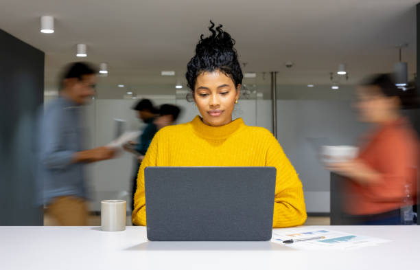 Businesswoman working at a busy office