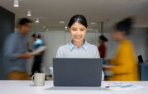 istock Businesswoman working at a busy office 2152247351