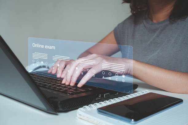 istock E-learning, education concept. Student passing online exam concept, online exam, choose correct answer in test knowledge, filling out an online survey form. Answer the test questions. 2152247512