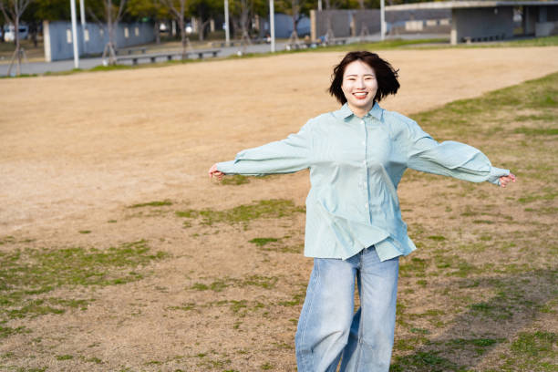 istock A woman having fun at the seaside 2152250874