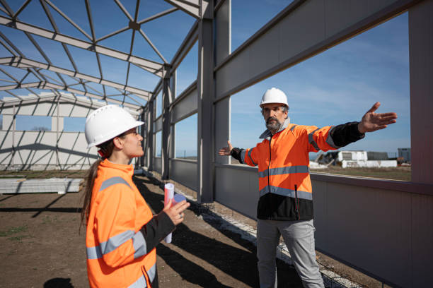 istock Civil Engineers Team at Construction Site. Building with Metal Cladding. 2152254446