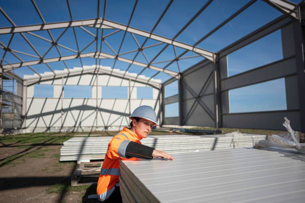 istock Woman Civil Engineer Inspects Metal Cladding for Building Facade. 2152254451