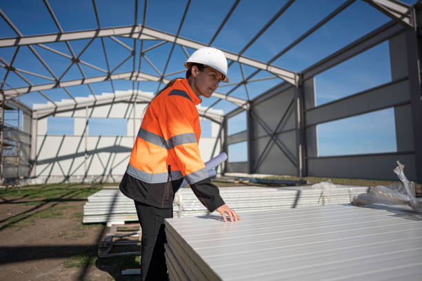 Woman Civil Engineer Inspects Metal Cladding for Building Facade.
