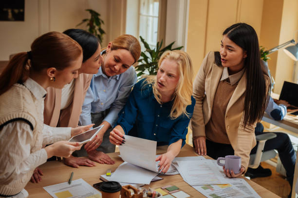 istock Five businesswomen making plans together 2152254895