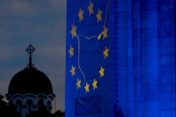 Bucharest, Romania. 9th May, 2024: The Arc de Triomphe is illuminated in the colors of the European Union flag to mark Europe Day in Bucharest.