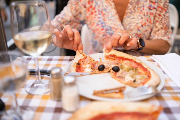 istock Close-up of pizza and wine on table 2152258943