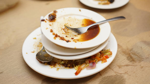 istock Stack of dirty plates with leftover food on table 2152260467