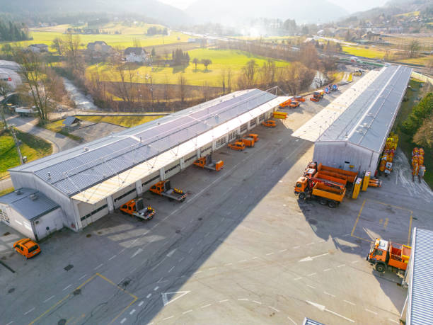 Aerial drone view of highway construction and maintenance company.
