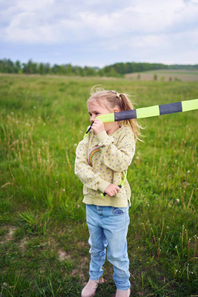istock a little girl got tangled in a kite's tail 2152261457