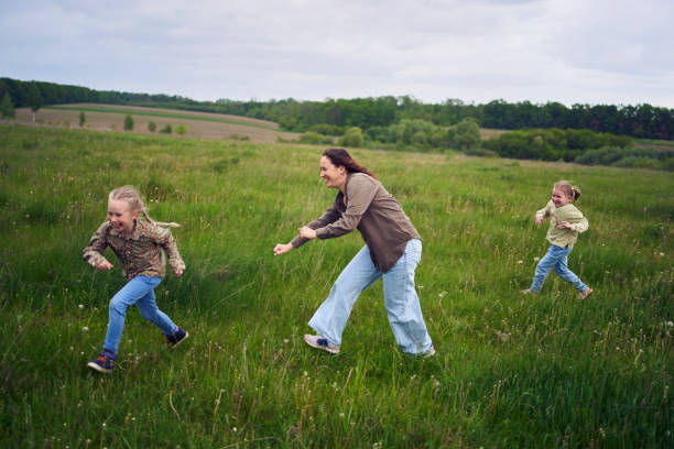 istock mother plays catch up with her daughters 2152261586