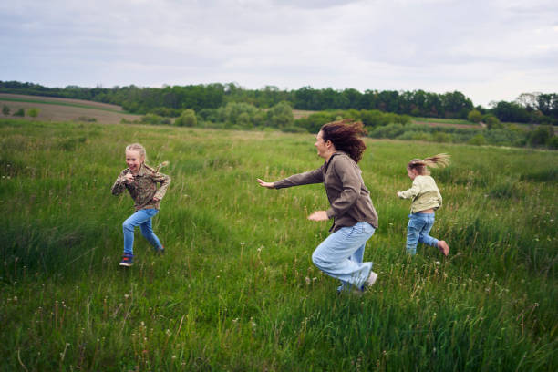 istock mother plays catch up with her daughters 2152261608