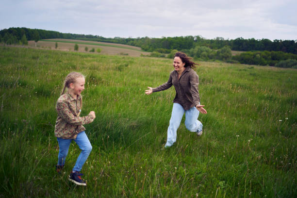 istock mother plays catch up with her daughters 2152261669