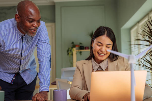 istock Male manager and his female intern working on a project 2152262103
