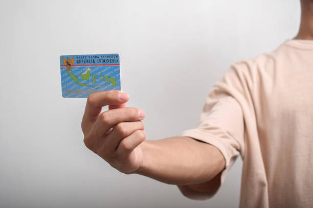 istock A person shows and holds Indonesian identity cards (KTP) 2152265744