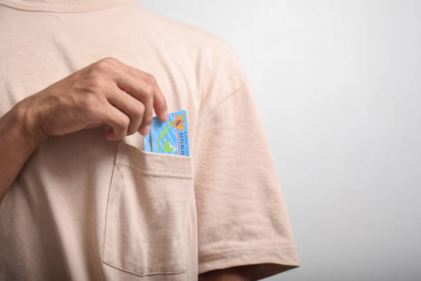 istock A person shows and holds Indonesian identity cards (KTP) 2152265746