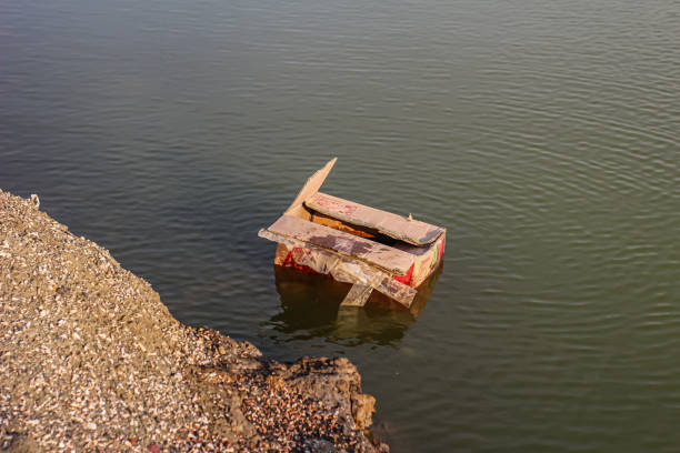 istock Cardboard thrown away in the fish pond 2152267204