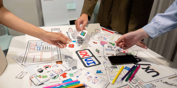 istock Brainstorm planning creative asian teamwork, Group of mobile phone app developer team meeting for share ideas about screen prototype layout for smartphone, ui, ux startup small business 2152268169