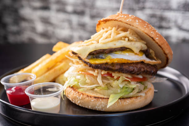 istock Cheese hamburgers sandwich with fried potatoes with black background, nice 2152268575