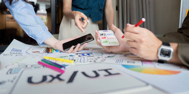istock Brainstorm planning creative asian teamwork, Group of mobile phone app developer team meeting for share ideas about screen prototype layout for smartphone, ui, ux startup small business 2152268927