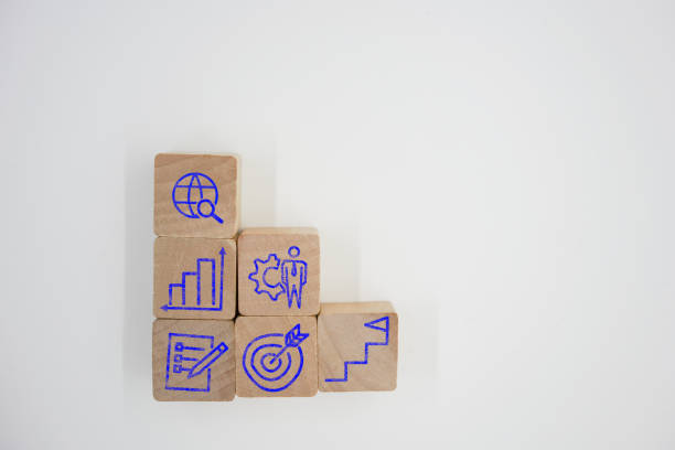 wood cubes with world search, graph growth, company, documents, target and success.