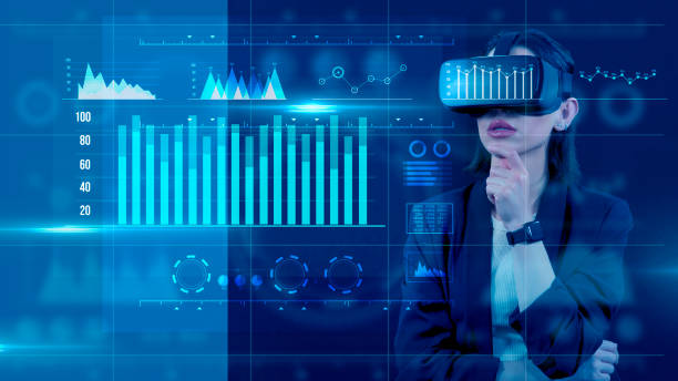 istock Young businesswoman using VR glasses with digital media interface. She’s working on a new project. She looks very busy. Blue hologram. Analytics. Virtual reality technologies for education GUI (Graphical User Interface) concept. 2152275141
