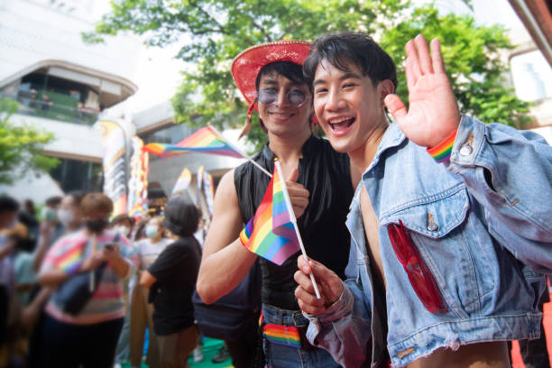istock LGBTQ men have fun celebrating their pride with flags at the annual Pride Parade 2152275413