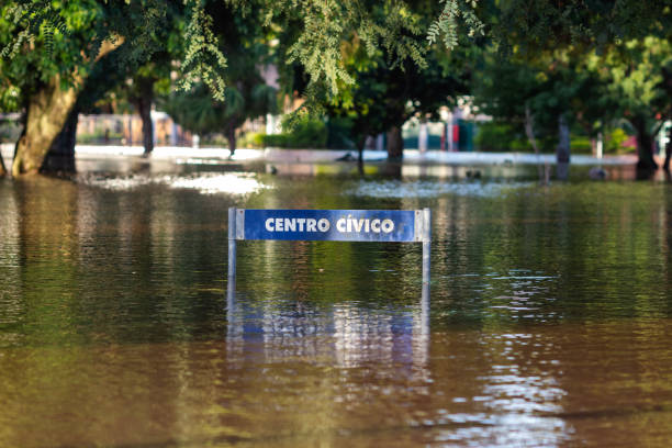 Flooded riverside with submerged traffic sign during Danube flooding in Budapest