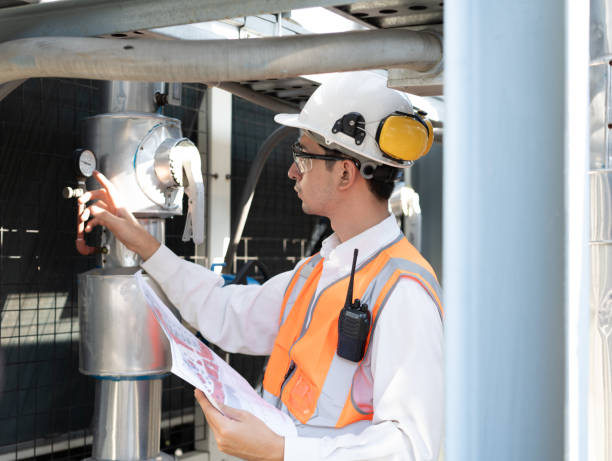 istock Engineers are inspecting a large building of use paperwork or industrial facility's cooling system for the air conditioning on rooftop building 2152277449
