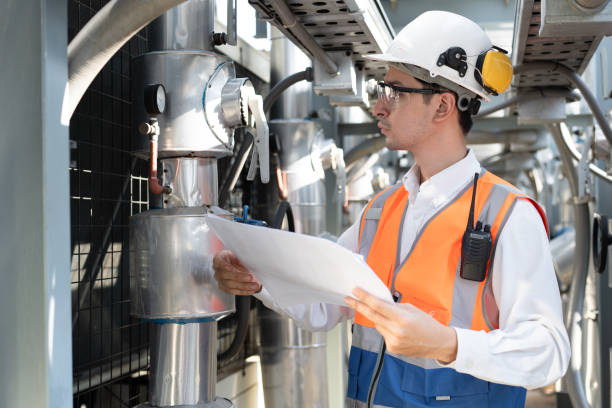 istock Engineers are inspecting a large building of use paperwork or industrial facility's cooling system for the air conditioning on rooftop building 2152277451