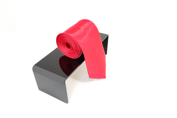 istock Plain fabric polyester necktie rolled on display stand with white background close-up view single object concept no people 2152278182