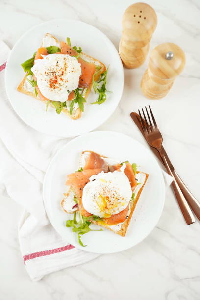 istock Eggs Benedict with smoked salmon, herbs, and hollandaise sauce 2152279302