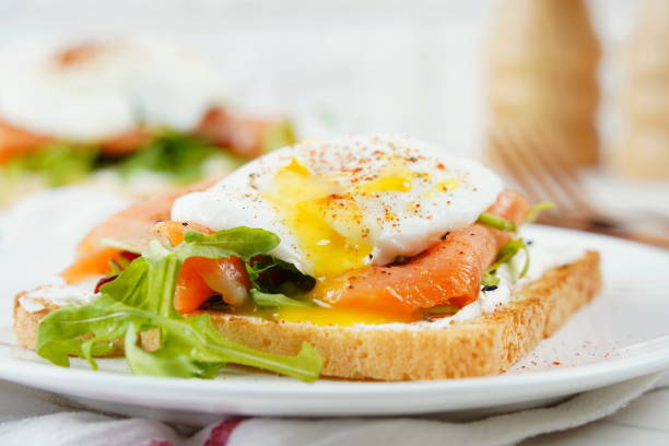 istock Eggs Benedict with smoked salmon, herbs, and hollandaise sauce 2152279304