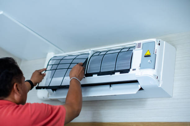 istock The air conditioner technician is assembling the dust filter to the air conditioner. 2152279993