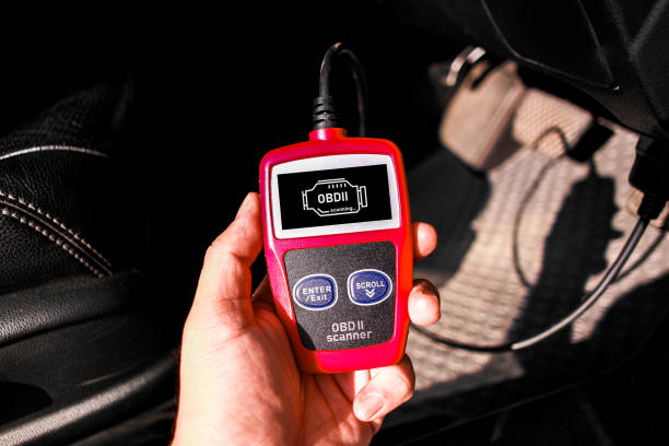 istock OBD scanner tool , OBD2 scanner in a car mechanic hand for car engine system analysis 2152282230